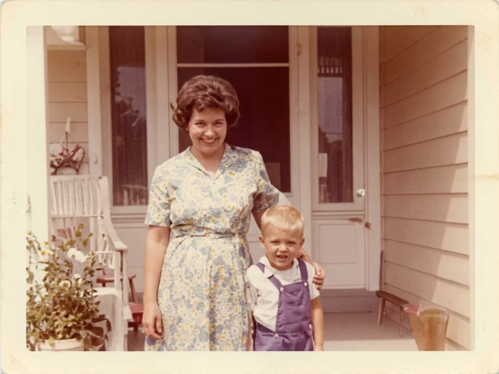 AI image upscaler result: restored and sharpened vintage 1970s photo of a mother and a boy on a porch