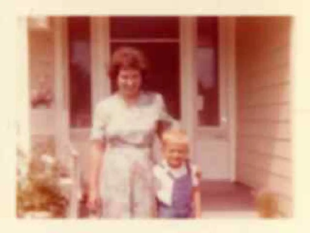 Blurry, low-resolution faded 1970s family photo before AI upscaling and restoration