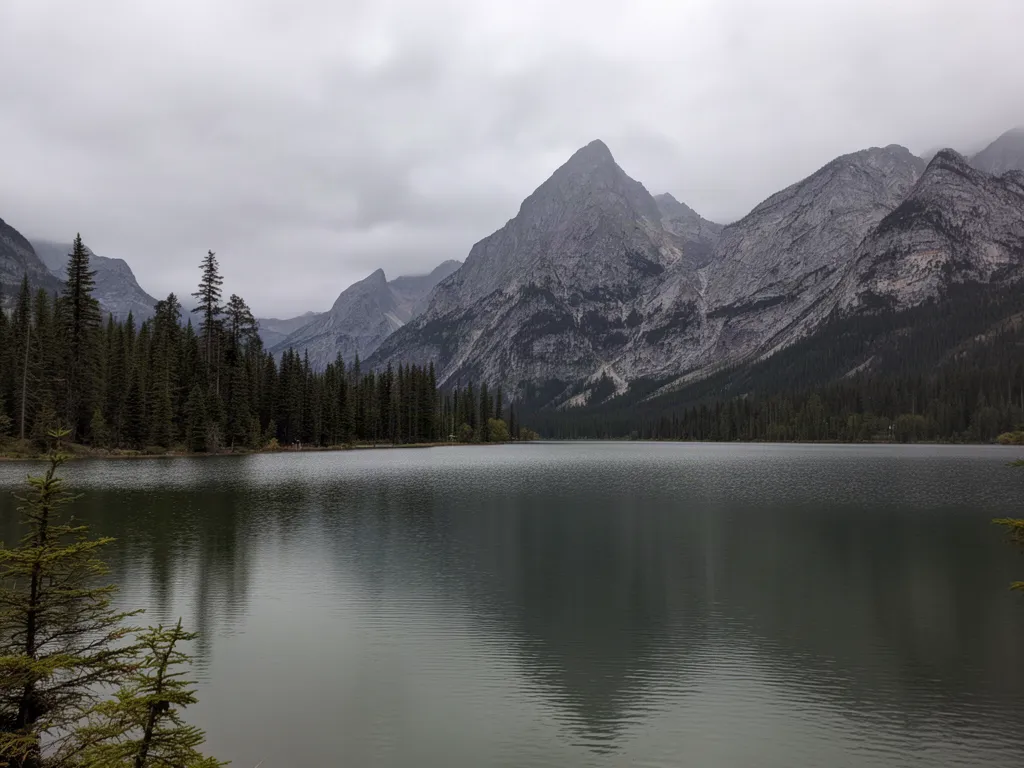 Original photo of a mountain lake with pine trees on a grey cloudy day